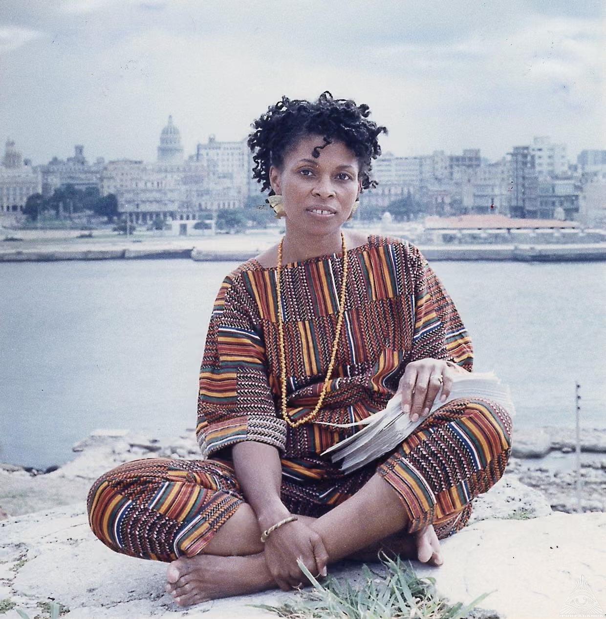 Assata Shakur sitting