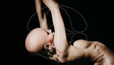 Artist nude dancing from a side view